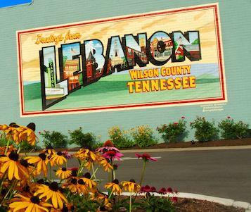 Lebanon, TN sign with flowers in the foreground